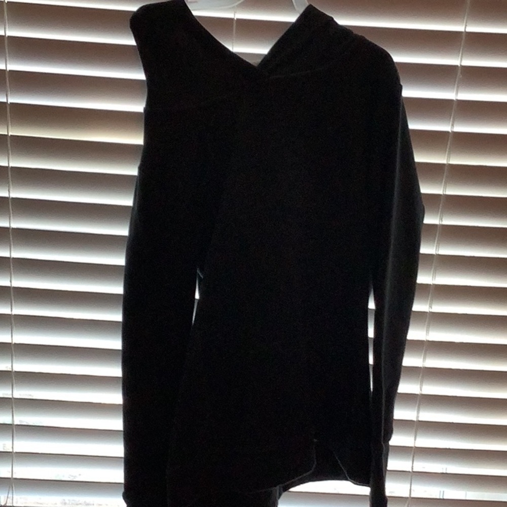 A dark grey hoodie/sweatshirt